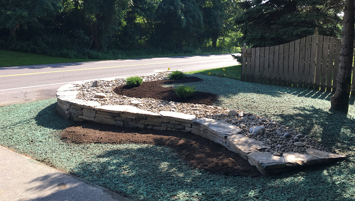 A sturdy and well designed retaining wall at a central new york home